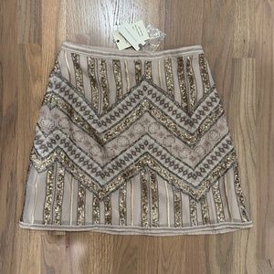 Sequined and lace mini skirt.